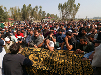 People wail during the funeral of a doctor who is killed in an alleged militant attack in the Nadigam area of Budgam district, Indian-admini...