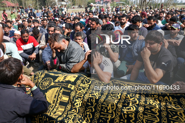 People wail during the funeral of a doctor who is killed in an alleged militant attack in the Nadigam area of Budgam district, Indian-admini...