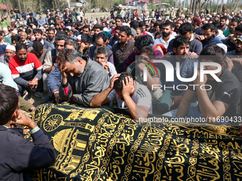 People wail during the funeral of a doctor who is killed in an alleged militant attack in the Nadigam area of Budgam district, Indian-admini...