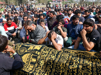 People wail during the funeral of a doctor who is killed in an alleged militant attack in the Nadigam area of Budgam district, Indian-admini...