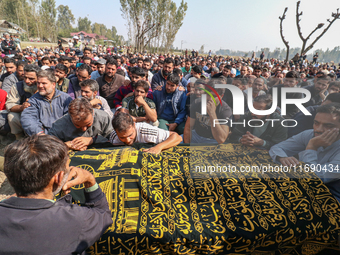 People wail during the funeral of a doctor who is killed in an alleged militant attack in the Nadigam area of Budgam district, Indian-admini...