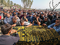 People wail during the funeral of a doctor who is killed in an alleged militant attack in the Nadigam area of Budgam district, Indian-admini...