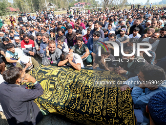 People wail during the funeral of a doctor who is killed in an alleged militant attack in the Nadigam area of Budgam district, Indian-admini...