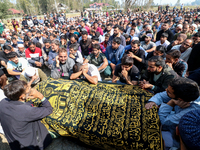 People wail during the funeral of a doctor who is killed in an alleged militant attack in the Nadigam area of Budgam district, Indian-admini...