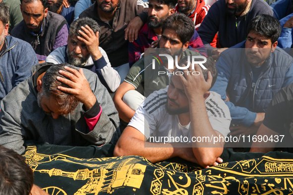 People wail during the funeral of a doctor who is killed in an alleged militant attack in the Nadigam area of Budgam district, Indian-admini...