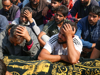 People wail during the funeral of a doctor who is killed in an alleged militant attack in the Nadigam area of Budgam district, Indian-admini...