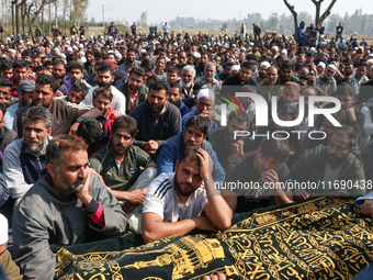 People wail during the funeral of a doctor who is killed in an alleged militant attack in the Nadigam area of Budgam district, Indian-admini...