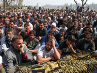 People wail during the funeral of a doctor who is killed in an alleged militant attack in the Nadigam area of Budgam district, Indian-admini...