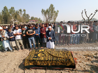 People attend the funeral of a doctor who is killed in an alleged militant attack in the Nadigam area of Budgam district, Indian-administere...