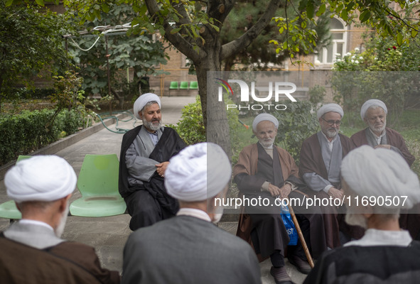 Iranian clerics sit together at a seminary in the historical city of Tabriz, located 624 km (388 miles) northwest of Tehran in the Eastern A...