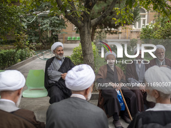 Iranian clerics sit together at a seminary in the historical city of Tabriz, located 624 km (388 miles) northwest of Tehran in the Eastern A...