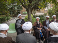 Iranian clerics sit together at a seminary in the historical city of Tabriz, located 624 km (388 miles) northwest of Tehran in the Eastern A...