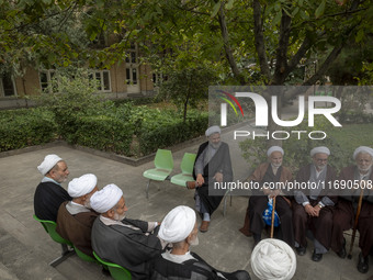 Iranian clerics sit together at a seminary in the historical city of Tabriz, located 624 km (388 miles) northwest of Tehran in the Eastern A...