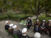 Iranian clerics sit together at a seminary in the historical city of Tabriz, located 624 km (388 miles) northwest of Tehran in the Eastern A...