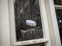 An Iranian cleric sits at a seminary in the historical city of Tabriz, located 624 km (388 miles) northwest of Tehran in the Eastern Azerbai...