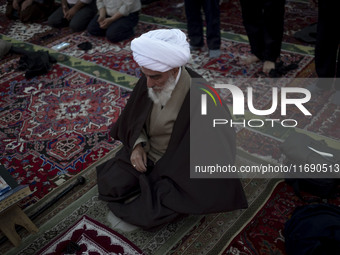 An Iranian cleric prepares to lead a mass prayer ceremony at a mosque in the historical city of Tabriz, located 624 km (388 miles) northwest...