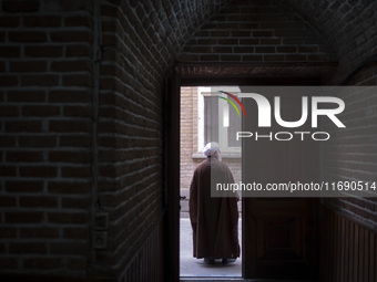 An Iranian cleric stands at the door of a mosque in the historical city of Tabriz, Iran, on October 17, 2024. (