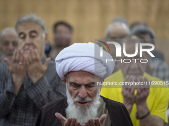 An Iranian cleric leads a mass prayer ceremony at a mosque in the historical city of Tabriz, located 624 km (388 miles) northwest of Tehran...