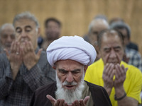 An Iranian cleric leads a mass prayer ceremony at a mosque in the historical city of Tabriz, located 624 km (388 miles) northwest of Tehran...