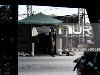 Armed soldiers work at a checkpoint in Yala Province, Thailand, on October 21, 2024. Yala is one of three provinces in Thailand's Deep South...