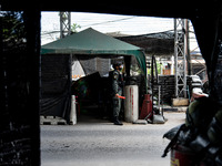 Armed soldiers work at a checkpoint in Yala Province, Thailand, on October 21, 2024. Yala is one of three provinces in Thailand's Deep South...