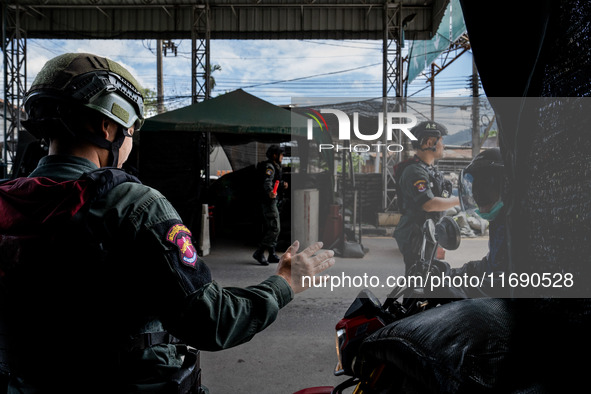 Armed soldiers work at a checkpoint in Yala Province, Thailand, on October 21, 2024. Yala is one of three provinces in Thailand's Deep South...