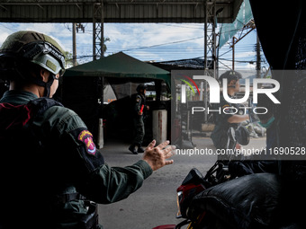 Armed soldiers work at a checkpoint in Yala Province, Thailand, on October 21, 2024. Yala is one of three provinces in Thailand's Deep South...