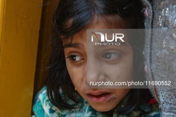 A girl weeps during the funeral procession of Kashmiri doctor Shahnawaz Dar in Nadigam village southwest of Srinagar, Jammu and Kashmir, on...