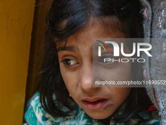 A girl weeps during the funeral procession of Kashmiri doctor Shahnawaz Dar in Nadigam village southwest of Srinagar, Jammu and Kashmir, on...