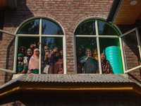 Relatives and mourners grieve during the funeral procession of Kashmiri doctor Shahnawaz Dar in Nadigam village, southwest of Srinagar, Jamm...