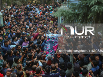 Relatives and mourners carry the body of Kashmiri doctor Shahnawaz Dar at Nadigam village southwest of Srinagar, Jammu and Kashmir, on Octob...