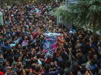 Relatives and mourners carry the body of Kashmiri doctor Shahnawaz Dar at Nadigam village southwest of Srinagar, Jammu and Kashmir, on Octob...