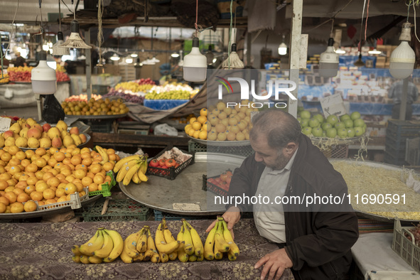 An Iranian salesman places bananas on a cart at a bazaar in the historical city of Tabriz, located 624 km northwest of Tehran in the Eastern...