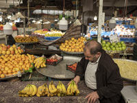 An Iranian salesman places bananas on a cart at a bazaar in the historical city of Tabriz, located 624 km northwest of Tehran in the Eastern...