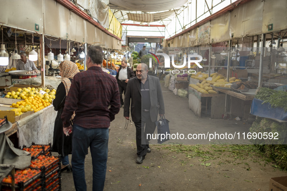 An Iranian man walks along a bazaar in the historical city of Tabriz, located 624 km (388 miles) northwest of Tehran in the Eastern Azerbaij...