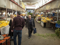 An Iranian man walks along a bazaar in the historical city of Tabriz, located 624 km (388 miles) northwest of Tehran in the Eastern Azerbaij...