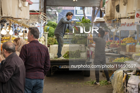 Iranian workers work at a bazaar in the historical city of Tabriz, located 624 km northwest of Tehran in the Eastern Azerbaijan Province, Ir...