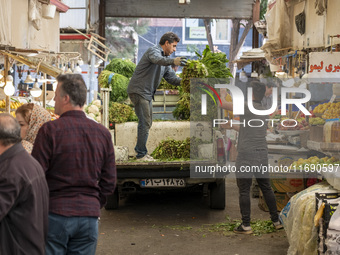 Iranian workers work at a bazaar in the historical city of Tabriz, located 624 km northwest of Tehran in the Eastern Azerbaijan Province, Ir...