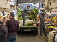 Iranian workers work at a bazaar in the historical city of Tabriz, located 624 km northwest of Tehran in the Eastern Azerbaijan Province, Ir...