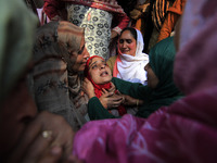 In Budgam, Kashmir, India, on October 21, 2024, a sister mourns over the dead body of Doctor Shahnawaz Ahmad Dar during his funeral ceremony...