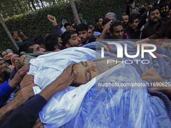 People carry the dead body of Doctor Shahnawaz Ahmad Dar during his funeral ceremony at his native village in Nadigam in central Kashmir's B...