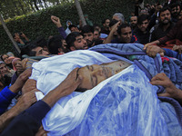 People carry the dead body of Doctor Shahnawaz Ahmad Dar during his funeral ceremony at his native village in Nadigam in central Kashmir's B...