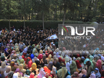 People carry the dead body of Doctor Shahnawaz Ahmad Dar during his funeral ceremony at his native village in Nadigam in central Kashmir's B...