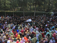 People carry the dead body of Doctor Shahnawaz Ahmad Dar during his funeral ceremony at his native village in Nadigam in central Kashmir's B...