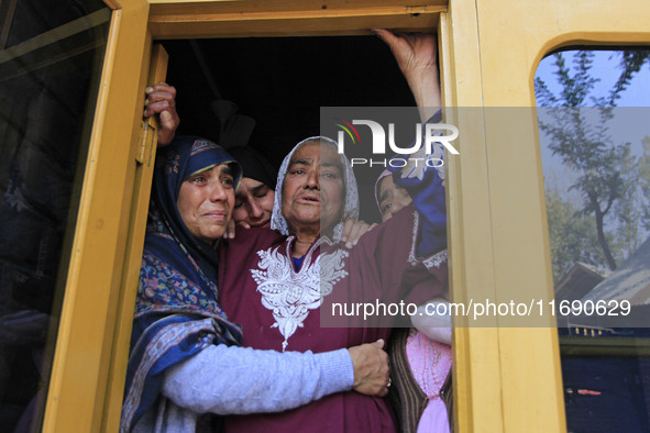 In Budgam, Kashmir, India, on October 21, 2024, the aunt of Doctor Shahnawaz Ahmad Dar wails during his funeral ceremony at his native villa...