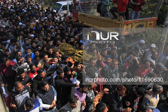 People carry the dead body of Doctor Shahnawaz Ahmad Dar during his funeral ceremony at his native village in Nadigam in central Kashmir's B...