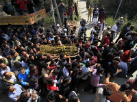 People carry the dead body of Doctor Shahnawaz Ahmad Dar during his funeral ceremony at his native village in Nadigam in central Kashmir's B...