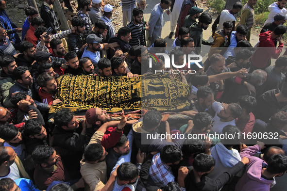 People carry the dead body of Doctor Shahnawaz Ahmad Dar during his funeral ceremony at his native village in Nadigam in central Kashmir's B...