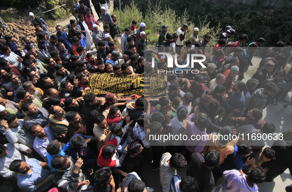 People carry the dead body of Doctor Shahnawaz Ahmad Dar during his funeral ceremony at his native village in Nadigam in central Kashmir's B...