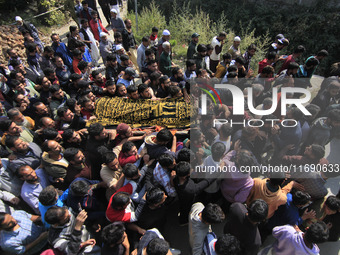 People carry the dead body of Doctor Shahnawaz Ahmad Dar during his funeral ceremony at his native village in Nadigam in central Kashmir's B...